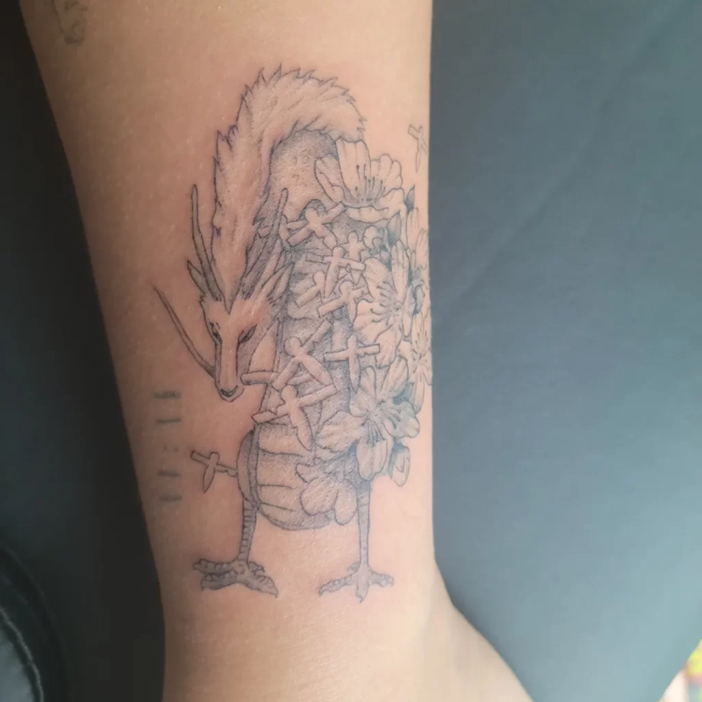 anime tattoo idea of Haku from spirited away on forearm