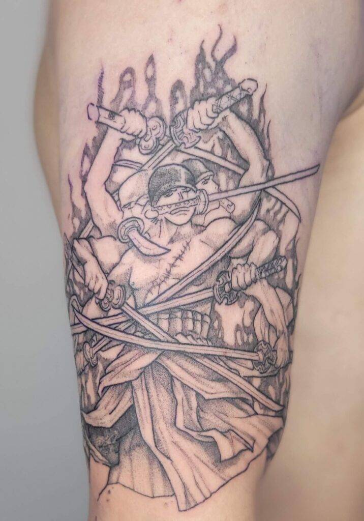 one piece tattoo of Zoro from one piece releasing his super power blade move on arm