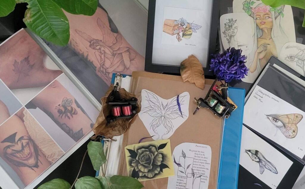 flash tattoo designs in their booklets created by Angeloop Ink in her private tattoo studio in Toronto