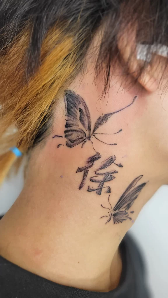 japanese letter tattoo on the neck of a male