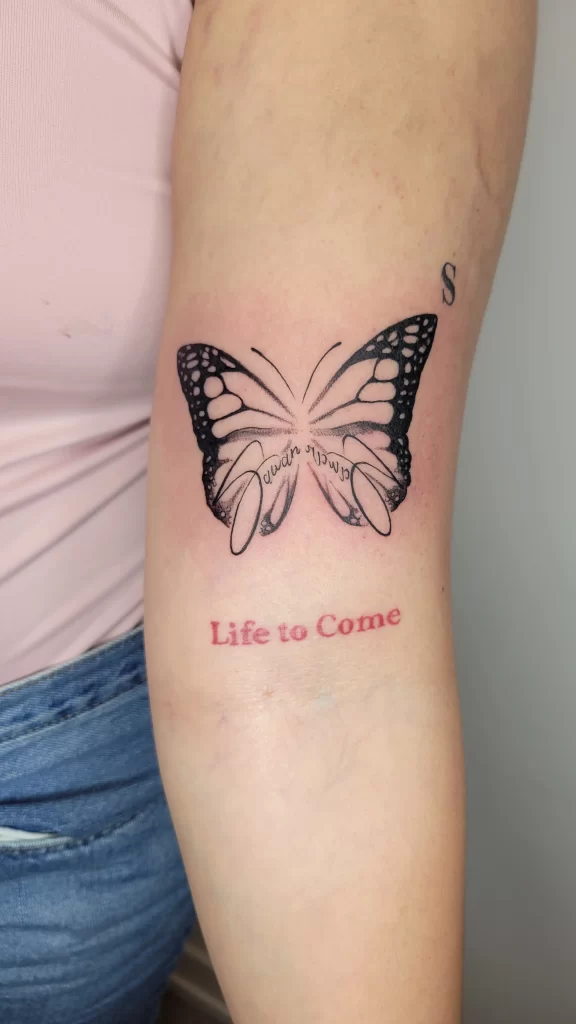 butterfly tattoo idea of a butterfly and a quote inside of it